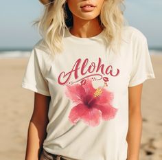 Tropical Comfort Colors Women's Shirt embodies summer vibes with its floral design, making it perfect for a beach vacation. These Hibiscus beachy tees are cute summer shirts for women looking to enjoy the season. 𝗗𝗘𝗧𝗔𝗜𝗟𝗦 👕 Comfort Colors, Unisex 👕 100% ring spun cotton 👕 Double-needle collar 👕 Twill taped neck and shoulders 👕 Double-needle armhole, sleeve, and bottom hems 𝗖𝗔𝗥𝗘 𝗜𝗡𝗦𝗧𝗥𝗨𝗖𝗧𝗜𝗢𝗡𝗦 👕 Machine wash cold. 👕 Wash like colors together. 👕 Non-chlorine bleach when White Tropical Print T-shirt For Summer, Spring Vacation T-shirt With Hibiscus Print, Pink Hibiscus Print T-shirt For Summer, Spring Tropical Print Graphic Tee, Tropical Vacation Tops With Sublimation Print, Tropical Tops With Sublimation Print For Vacation, Spring Graphic Tee With Tropical Print, Graphic Tee With Tropical Print For Spring, Trendy Sublimation Print Tops For Vacation