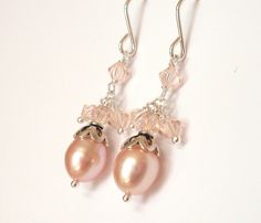 Delicate in pale peach, these earrings feature a beautiful freshwater pearl drop crowned with a scalloped Sterling Silver bead cap, below dangles of Swarovski crystal beads.  All metal is Sterling Silver. These lustrous pearls and sparkling Austrian crystals are a sweet and airy combination. The pearls are a warm natural peach pink. The crystals are the color Silk, a very pale peach.  Ball headpins for added detail and texture. The crystals are all 4mm in size. Two little dangles either side of a central crystal, a fourth one above.  The hooks are a simple sleek style. The earrings fall 1" (or 25mm) from the bottom of the hook. Code: E313ss To see other items in my shop, enter here: https://www.etsy.com/shop/ArtfulTrinkets1?ref=hdr_shop_menu PLEASE NOTE: Shipping to "everywhere else" will Elegant Peach Dangle Earrings, Elegant Apricot Earrings For Gift, Handmade Apricot Earrings Elegant Style, Handmade Elegant Apricot Earrings, Handmade Apricot Earrings In Elegant Style, Elegant Apricot Dangle Earrings, Elegant Apricot Dangle Jewelry, Elegant Peach Pearl Jewelry, Elegant Handmade Peach Jewelry