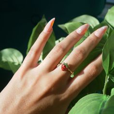 Strawberry Ring Adjustable Gold Ring Cute Jewelry Adorable Strawberry Ring Gift for Her Cottagecore Jewelry Fairy Ring Fairy Jewelry Gold __LISTING DESCRIPTION ☽ 18k Gold Plated Adjustable Ring, Enamel ☽ This ring is gold plated and may require extra care. PLEASE follow these tips to make the ring last longer in its original condition: avoid wearing it to the beach, pool, shower, bathtub, hot tub; avoid it touching any lotions, creams, or sweat; take it off before going to bed ☽ Packaged with a Whimsical Adjustable Rings, Cute Tiny Rings For Gifts, Cute Small Ring As Gift, Cute Flower Ring Gift, Fairycore Flower Shaped Jewelry Gift, Fairycore Flower Jewelry For Gifts, Cute Red Ring For Gift, Cute Red Ring As Gift, Cute Handmade Flower Ring For Gift