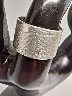 Hand-crafted texture Sterling silver band. Approximately 1/2" inches, Size 7 1/2 Hand Forged Silver Brutalist Jewelry, Silver Brutalist Jewelry With Oxidized Finish, Brutalist Sterling Silver Rings, Mens Silver Rings Handmade Jewelry1000.com, Silver Brutalist Hand-cast Rings, Sterling Silver Bands, Silver Band, Texture, Band