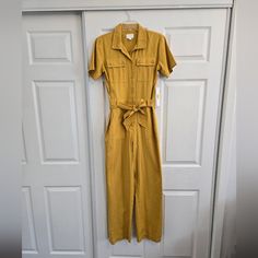 Sadly Never Got To Wear This Before It Became Too Small. The Mustard Yellow Color And Utility Style Is Very Vintage/Mid Century Modern. You Can Feel The Quality From The Fabric To The Hems And Fabric Covered Buttons. Buttons Are All Functional And Tie At The Waist Can Be Removed. 100% Cotton So No Stretch At All. Purchased From Dillard's. Grey One Piece, Safari Green, Mustard Yellow Color, Yellow Romper, Utility Jumpsuit, Pink One Piece, Utility Style, Vintage Mid Century Modern, Striped Jumpsuit