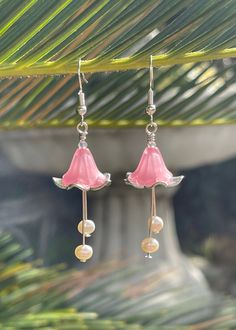 Pink Lucite and Tibetan Silver Floral Bell Earrings with Freshwater Pearls. These lightweight earrings have a fairy core, cottage core vibe. They are beautiful. The floral bell is made of pink lucite over Tibetan silver. The stamen part of the floral bell is made of silver plated wire and 4mm freshwater pearls. These are beautiful high luster pearls From where the ear wires insert into the ear, the earrings measure 2 1/4 inches. The ear wires are marked S925. In order to keep prices affordable, unless I specifically indicate I am using pure gold or silver in my description, the title refers to metal color only. I try to use hypoallergenic metals or plated metals. I try to use nickel-free and lead-free findings. Since my findings come from outside sources, I cannot guarantee the metal conte Pink Fairycore Earrings As Gift, Fairycore Pink Earrings As Gift, Fairycore Pink Earrings For Gifts, Bell Earrings, Flower Earrings Gold, Core Cottage, Bead Earring, Earring Ideas, Pretty Jewelry