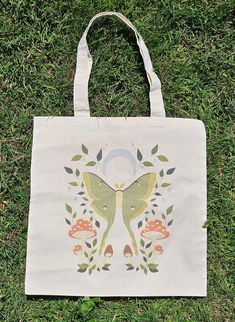 ☆ 15" x 16" tote bag ☆ 100% natural cotton canvas fabric ☆ All artwork is designed and drawn by me! Artistic Eco-friendly Canvas Bag, Artistic Beige Canvas Tote Bag, Artsy Cotton Tote Bag, Artsy Canvas Tote Bag, Cotton Canvas Fabric, Luna Moth, Art Bag, Bag Ideas, Bag Cute