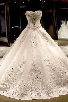 a white wedding dress on display in a store