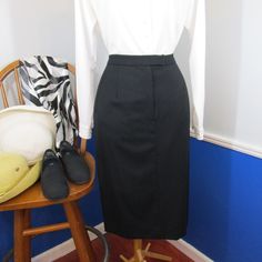 Nwot (The Pockets Are Still Sewn Shut) Classic Black A-Line Skirt. Front Zip With Two Button Closure, Side Pockets, And A Left Side Vent. Fully Lined. No Flaws Found. Material And Size Tags Missing, Feels Like A Wool/Cashmere Blend Fabric. Fits Like Size 8-10. Size / Measurements Taken While Flat - 8-10p Waist: 15” Hips: 21" Length: 26" Mid Calf On 5'3" Woman. Currently Hanging In A Bag Waiting For The Right Person. Open To Reasonable Offers. Black Pencil Skirt With Button Closure For Work, Formal Black Skirt With Button Closure, Fitted Black Skirt For Daywear, Formal Fitted Skirt With Button Closure, Formal Fitted Pencil Skirt With Button Closure, High Waist Fitted Skirt For Daywear, Fitted High Waist Skirt For Daywear, Vintage Black Skirt With Buttons, Classic Black Skirt With Buttons