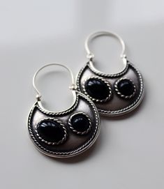 Silver boho style hoops with black stones, not heavy on the ears but also very high quality. Can be styled in many occasions,such as day and night. Black Bohemian Pierced Jewelry, Black Bohemian Sterling Silver Earrings, Handmade Black Hoop Earrings For Festival, Black Bohemian Hoop Earrings For Festivals, Bohemian Nickel-free Black Hoop Earrings, Bohemian Black Nickel-free Hoop Earrings, Handmade Black Sterling Silver Hoop Earrings, Black Handmade Sterling Silver Hoop Earrings, Bohemian Black Round Earrings