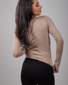 Made from our buttery soft domestically produced rayon spandex fabric these tops will easily become your go to T's. They can easily be worn at the office, with a pair of jeans, or as an elegant top for a long skirt. The back shaping seam helps to create that perfect hourglass silhouette and helps to keep it from sliding up your body. Made in USA providing jobs for American workers Pull over style Buttery soft rayon/spandex domestically produced fabric crew neck; long sleeves; back shaping seam H Hourglass Silhouette, Knit Long Sleeve, Crew Neck Top, Knitting Women, Spandex Fabric, Long Skirt, The Office, Long Sleeves, Spandex