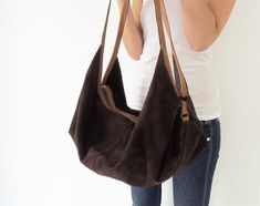 "DeLuna is a large hobo bag designed for women who love to carry slouchy handbags. Featured in this listing in suede leather, in dark brown and camel, it has plenty of room for all your essentials which makes it the perfect carryall bag. The contrast of the two-tone colors on the straps and on the main body is what makes the design unique and stand out. The straps sit comfortably on your shoulder and the bag is secured with a top zipper closure. Inside the bag, there is one main compartment with Handmade Leather Bag Woman, Suede Hobo Bag, Leather Bag Tutorial, Weekender Bags, Large Hobo Bag, Large Leather Bag, Slouchy Bag, Leather Bag Pattern, Simple Backpack