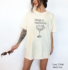 Custom Bachelorette Party Tshirt | Margs and Matrimony Theme These tshirts are customizable to ensure your design is perfectly unique to your party! Comfort Colors Tshirt: ~Unisex Adult Sizing ~100% Cotton ~DTG (Direct To Garment) printing, which means the ink is directly printed into the fabric Sizing: ~Please refer to the sizing chart within the listing before purchasing | For an oversized fit, please order 1-3 sizes up.  Care: ~Please refer to the care instructions within the listing before purchasing  Please note, we DO NOT accept cancellations, returns or exchanges since all items are made to order. PLEASE make sure all sizing and shipping information is correct before placing the order. Thank you for supporting my small business! Fitted Party T-shirt With Custom Print, Vintage Fitted Top With Custom Print, Fitted Vintage Tops With Custom Print, Fitted Vintage Top With Custom Print, Fitted Short Sleeve Tops For Anniversary, Summer Cotton Tops For Anniversary, Vintage Cotton Tops For Anniversary, Cotton Tops For Summer Anniversary, Cotton Tops For Anniversary In Summer