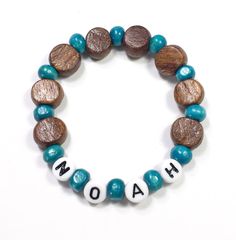 "Bracelet for Boys. Boys Wood beaded bracelet. These Personalized name bracelets make great Party Favors, Stocking Stuffers, Valentines, or easter basket fillers for Boys or girls. They're Hypoallergenic make with wood beads and acrylic letters. Available with Navy, Red, Lime, or Turquoise accent beads. Made on durable stretch cord. Sized by age. See Order info below. Upgraded gift packaging also available at the link below. Our standard free packaging is an organza drawstring bag and sparkly ti Bracelet For Boys, Bracelet Party, Wood Bead Bracelet, Easter Basket Fillers, Girl Scout Troop, Basket Fillers, Turquoise Accents, Acrylic Letters, Valentines For Boys