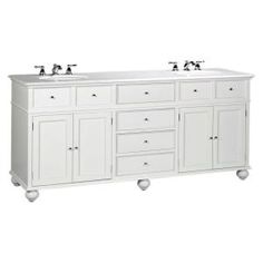 a white double sink vanity with two faucets on each side and three drawers