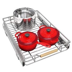 two red pots and pans are sitting on a rack