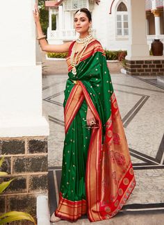 Wrap yourself in elegance with our Green Silk Woven Zari Broad Border saree. The multi-thread weaving creates a soft, luxurious feel perfect for any occasion. Comes with a contrasting red blouse to complete the look. Stand out in style in USA, UK, and Canada. The unstitched blouse can be customized unto 44 inches. Do Note: All the accessories shown are for styling purpose only. Slight color variation may occur due to photographic reasons. Fall and Pico : Done Drapping Saree(Ready to wear) : On R Red Blouse Saree, Drapping Saree, Red Saree Blouse, Paithani Silk Saree, Paithani Saree, Purple Saree, Orange Saree, Paithani Sarees, Indian Saree Blouse