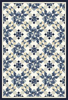 a blue and white quilt with an intricate design