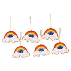 six wooden rainbows hanging from strings on a white background