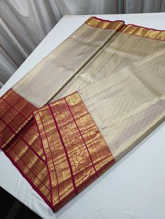 High quality pure Kanjeevaram silk saree wid blouse piece . Gold Saree With Traditional Patterns In Tissue Silk, Gold Blouse Piece With Traditional Patterns, Designer Paithani Silk Traditional Wear In Gold, Gold Paithani Silk Blouse With Traditional Patterns, Designer Gold Paithani Silk Saree, Elegant Blouse Piece With Traditional Patterns For Puja, Designer Gold Paithani Silk Traditional Wear, Gold Paithani Silk Traditional Wear, Transitional Gold Saree With Traditional Patterns