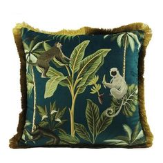 a pillow with monkeys and plants on it