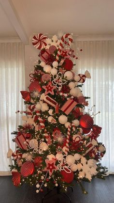 a christmas tree decorated with candy canes and candies