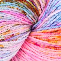 multicolored skeins of yarn are shown in this close up image photo