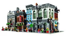 a large lego building with people on the top floor and windows in front of it