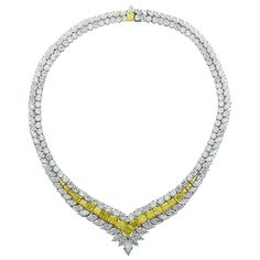 Sensational diamond necklace finely crafted in Platinum and 18 karat yellow gold, featuring Fancy Intense yellow diamonds and white diamonds weighing approximately 80.81 carats total. This exceptional necklace showcases 5 GIA Certified Fancy Intense yellow radiant cut diamonds weighing 6.21 carats total, VS-SI clarity, 11 Fancy Intense yellow radiant cut diamonds weighing approximately 9 carats total, VS-SI clarity, 8 Fancy Intense yellow round brilliant cut diamonds weighing approximately .6 ca Heart Shaped Diamond Necklace, Diamond Infinity Necklace, Yellow Diamond Necklace, White Diamond Necklace, Rare Diamond, Yellow Diamonds, Fancy Yellow Diamond, Fancy Necklace, Heart Necklace Diamond