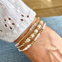 Band: Flat woven; 3/4"w; 14k gold-filled clasp & 1" extender chain; glass seed beads. Strands: Stretch style; 14k gold-filled 3mm & 4mm round beads; freshwater pearls; vinyl heishi disks; glass seed beads. Great solo or stacked. Bracelet Size Guide Neutral Seed Bead Bracelet, Disk Bracelet Ideas, Adjustable Gold Single Strand Beaded Bracelet, Gold Heishi Beads Bracelet With Beaded Chain, Dainty White Stretch Bracelet With Gold Beads, Adjustable Gold Beaded Everyday Necklaces, Adjustable Gold Beaded Necklaces For Everyday, White Beaded Chain Bracelets, Adjustable Single Strand White Bracelet