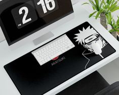 a desktop computer sitting on top of a desk next to a keyboard and mouse pad