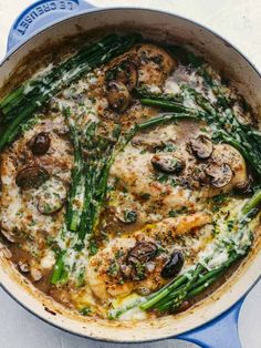 a skillet filled with mushrooms and asparagus