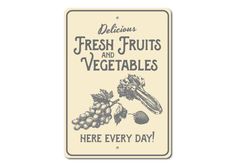 a sign that says delicious fresh fruits and vegetables here every day with grapes, raspberries