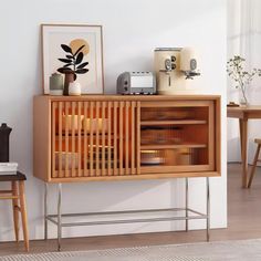 a wooden cabinet sitting on top of a hard wood floor