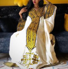 Gondar Fetil Ethiopian Gondar Amhara Yellow Embroidery Fetil Dress - Etsy Festive White Dress With Gold Embroidery, Ceremonial Dresses With Gold Embroidery For Festivals, Ceremonial Long Sleeve Maxi Dress, White Floor-length Dress With Gold Embroidery, Elegant White Embroidered Dress For Festivals, White Ceremonial Dress With Zari Work, Ceremonial White Dress With Zari Work, Traditional Gold Maxi Dress For Eid, Gold Embroidered Dresses For Traditional Ceremonies And Festivals