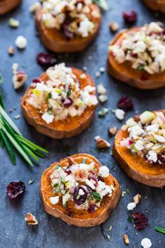 baked sweet potatoes topped with cranberries and nuts