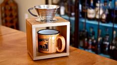 a wooden box with a coffee cup on it