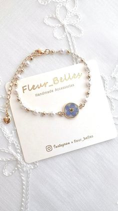 Thank you for visiting Fleur_Belles! ✨💙This Forget Me Not bracelet is linked with imitation pearls. They are so gorgeous💙✨  Chain length: 14 chain with 5cm extender Pendant size: 1cm x 1cm 🌺Due to the handmade nature of this product, slight variations may occur, however, the design remains as similar as possible. 💖CARE about the handmade accessories 💖 Please keep in a dry place and avoid prolonged direct sunlight, water, chemicals and perfumes to maintain and preserve the beauty. Flowers Bracelets, Pearl Bracelet Gold, Valentines Gifts For Her, Flower Bracelet, Forget Me Not, Gold Plated Chains, Handmade Accessories, Gifts For Mum, Pressed Flowers