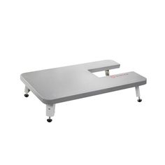 a white table with wheels on it and a gray surface in front of the table