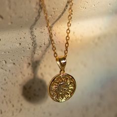 Radiate in our Sun necklace. - Waterproof, tarnish resistant & hypoallergenic- Made in gold vermeil: a thick 18k gold layer on sterling silver.- Adjustable chain 17 to 18 in.- Pendant size: 12.5 mm Hypoallergenic Round Gold-plated Necklaces, Gold-filled Coin Necklace Gift, Tarnish Resistant, 14k Gold Filled Tarnish Resistant Round Pendant Necklace, 14k Gold Filled Tarnish Resistant Coin Necklace Gift, Gift 14k Gold Filled Coin Necklace, Tarnish Resistant, 14k Gold Filled Coin Necklace Gift, Hypoallergenic Yellow Gold Plated Charm Necklaces, Hypoallergenic Yellow Gold Necklace With Round Pendant, Hypoallergenic Yellow Gold Plated Charm Necklace