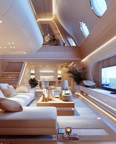 a living room filled with white furniture and lots of lights on the ceiling above it