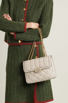 Inspired by styles from Gucci's archives, this boxy 'Deco' shoulder bag is made from quilted leather and accented with the brand's interlocking 'GG' logo. Adjust the chain strap to carry it on your shoulder or as a top handle. Gucci Deco Bag, High-end Quilted Shoulder Bag For Formal Occasions, Luxury Beige Shoulder Bag With Turn-lock Closure, Designer Rectangular Shoulder Bag With Cc Turnlock Closure, Gucci Quilted Leather Shoulder Bag, Classic Quilted Gucci Shoulder Bag, Elegant Everyday Luxury Quilted Shoulder Bag, Gucci Leather Bag With Turn-lock Closure, High-end Quilted Shoulder Bag For Everyday Luxury