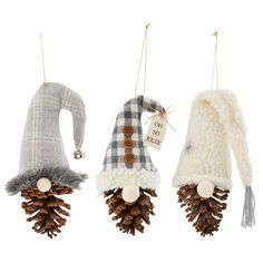 three christmas ornaments hanging from strings with pine cones and scarfs attached to each ornament