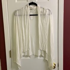 Cream Sheer Cardigan White Shrug For Spring Layering, White Open Front Sweater For Layering, Spring Wrap Shrug, White Long Sleeve Shrug For Spring, White Wrap Cardigan For Fall, Spring Long Sleeve Shrug One Size, Chic One Size Open Front Top, White Spring Cardigan For Layering, Spring Open Front Shrug For Layering