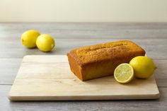 a loaf of lemon pound cake on a cutting board