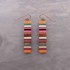 These lightweight geometric rectangle Statement earrings combine the simplicity and versatility of modern design with the bright warmth of southwest colors. This pair of earrings is made from reclaimed African Ebony, Purpleheart, white Maple, Mahogany, and upcycled dyed maple woods. They are also inlaid with %100 pure recycled copper inlays and Finished with 14k rose gold filled fish hook ear wires. Hypoallergenic and lightweight with a strop physical presence Designed and handmade by Josiah Eidmann in Kenosha, WI. Ships quickly and safely packaged in a cotton filled gift box. Southwest Colors, Upcycled Wood, Wood Burning Crafts, Earrings Hypoallergenic, Clay Craft, Rectangle Earrings, Long Dangle Earrings, Ceramic Jewelry, Bead Jewelry