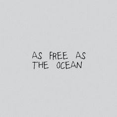 the words as free as the ocean written in black ink