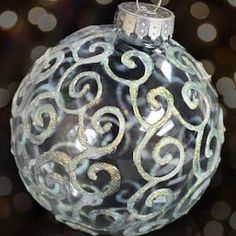 a glass ornament with the words glitter swirls on it and an image of a