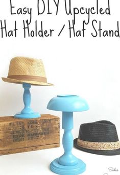 two hats sitting on top of a blue table next to a wooden box with the words easy diy upcycled hat holder