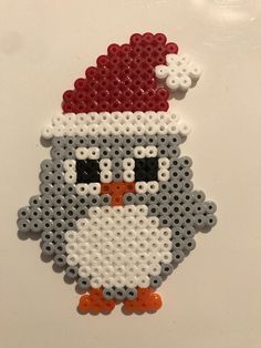 a christmas ornament made out of legos with a santa hat on it