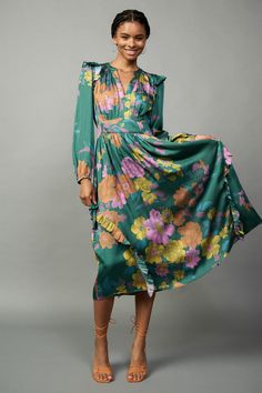 Combining a colorful floral print and feminine ruffle trim, this long-sleeve midi dress is a true stunner. It's breezy and flattering, designed with a split neckline, a clean placket, and a gathered bodice drawn in by smocking at the back waist. •Split neckline •Long sleeves •Ruffle trim •Smocked back waist •Mid-length Luxury Multicolor Casual Midi Dress, Luxury Summer Midi Dress With Vibrant Print, Luxury Multicolor Midi Dress For Fall, Luxury Casual Printed Midi Dress, High-end Floral Print Long Sleeve Dress For Fall, Mob Printed Long Dress, Floral Print Midi Dress Formal, Luxury Floral Print Fall Midi Dress, Luxury Printed Midi Dress For Evening