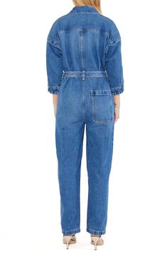 With a classic blue wash, this belted jumpsuit with a zip-front closure and plethora of pockets is a stylish way to make an all-denim statement. Point collar Three-quarter sleeves 77% cotton, 23% Tencel® Refibra™ lyocell Tencel Refibra lyocell is a sustainably produced fiber made from wood pulp and recycled cotton scraps using closed-loop processing Machine wash, line dry Imported Denim Belted Overalls Jumpsuits And Rompers, Medium Wash Denim Jumpsuit With Belt Loops, Spring Denim Belted Jumpsuits And Rompers, Casual Denim Belted Jumpsuits And Rompers, Spring Denim Jumpsuit With Belt Loops, Denim Jumpsuit With Belt Loops For Workwear In Spring, Chic Denim Belted Jumpsuits And Rompers, Spring Denim Jumpsuit For Work With Belt Loops, Spring Denim Jumpsuit With Belt Loops For Work