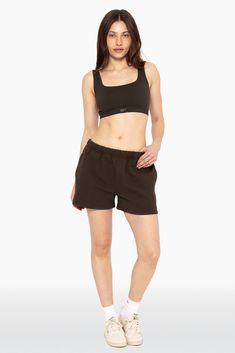 Step into casual elegance with our Sweat Shorts in Espresso. Featuring a leg-lengthening fit, clean sewn bottom hem, and high rise, these shorts offer both comfort and style. Embroidered with the SET logo on the upper right thigh, they add a touch of sophistication to your loungewear collection. Sweat Shorts, Casual Elegance, Espresso, Lounge Wear, High Rise, ? Logo