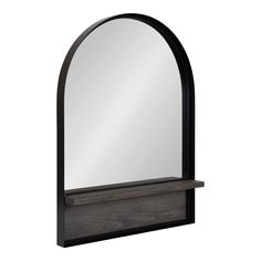 an arched mirror on a wooden shelf with a black frame and wood shelves underneath it